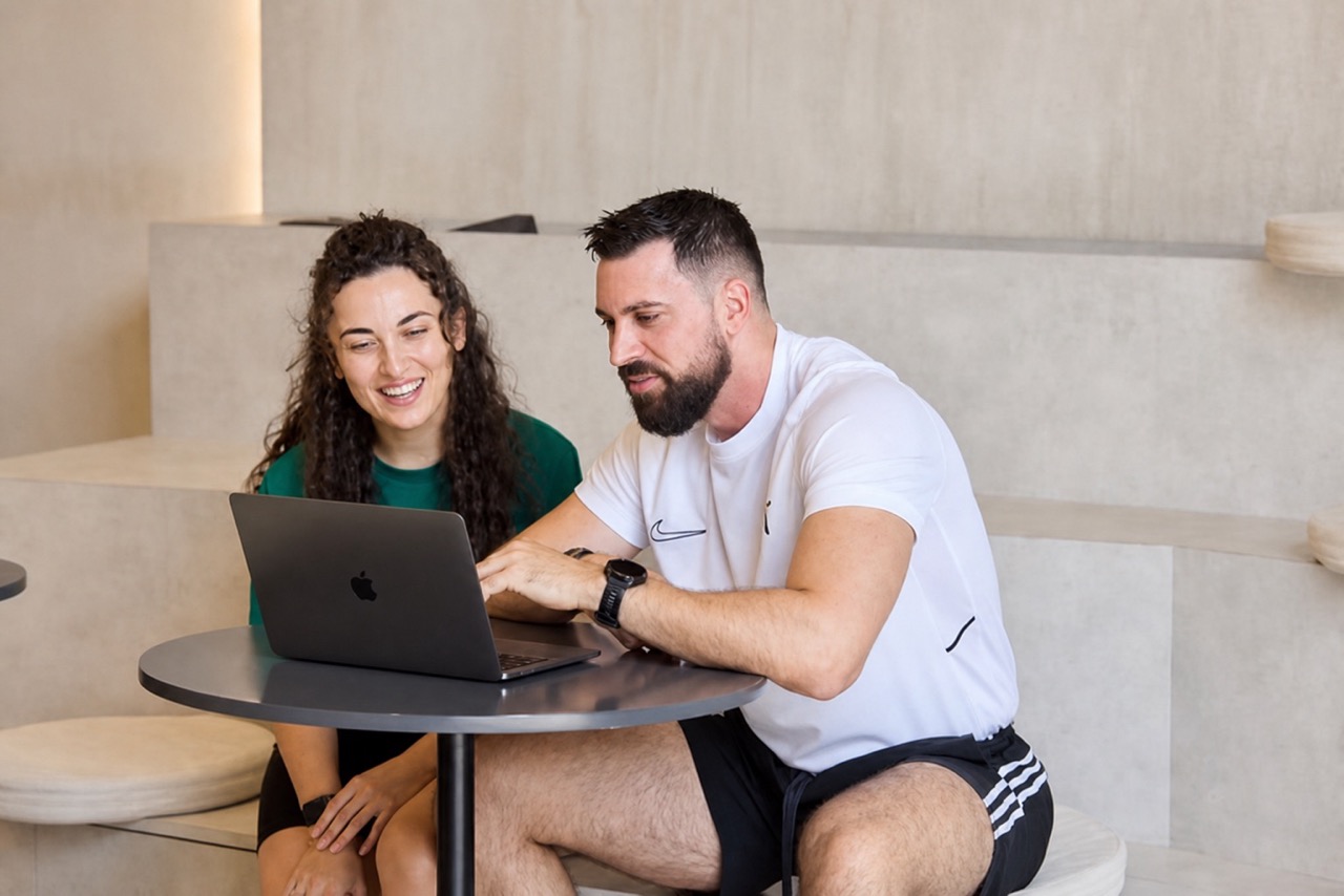 Goran and a client reviewing a plan together